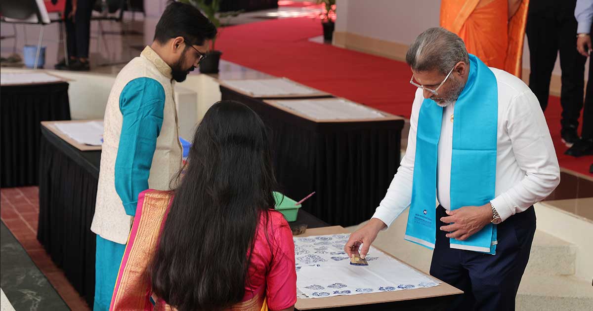 Participants create art at Afflatus 2023, showcasing traditional techniques and collaboration.