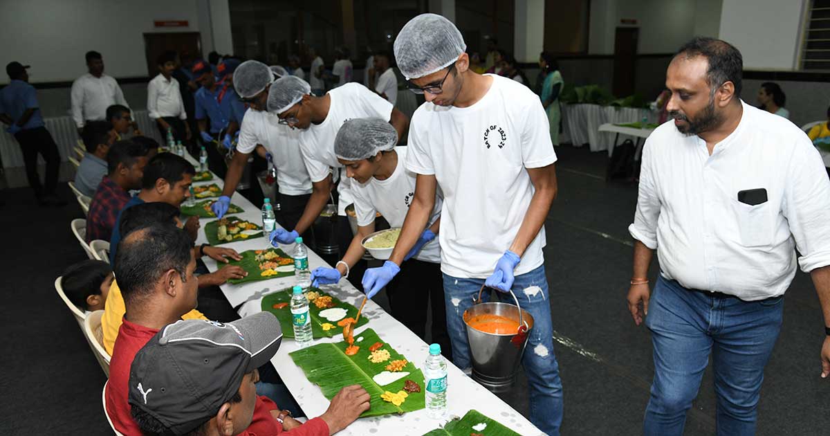 Students serve traditional meals on banana leaves during Teacher’s Day celebrations at JIRS.