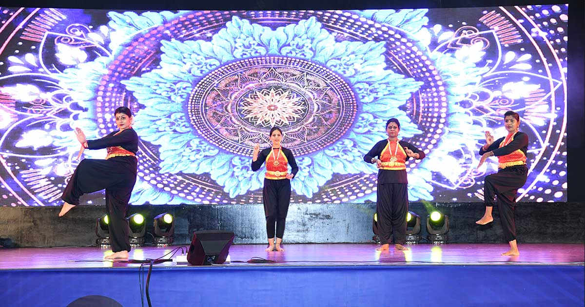 Four dancers in traditional outfits perform on stage during Children's Day 2023 Celebrations at JIRS.