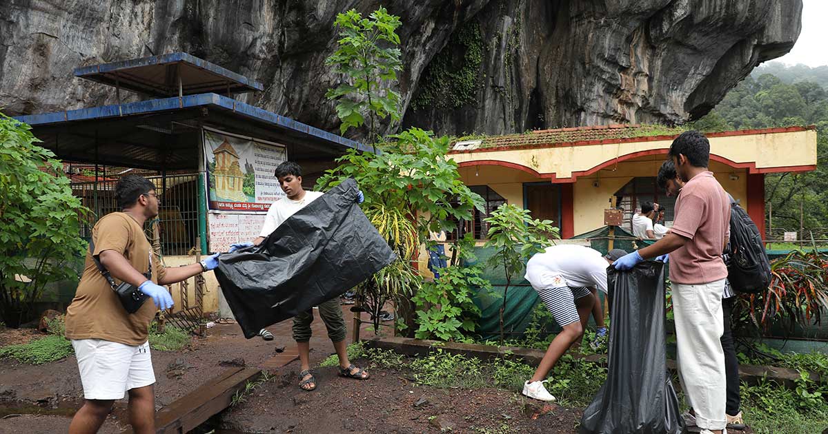 Participants collect trash during the IBDP Year 2 CAS Trip 2023 community cleanup at JIRS.